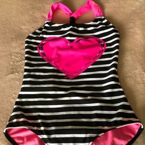Black and white striped one-piece w/ pink accents.